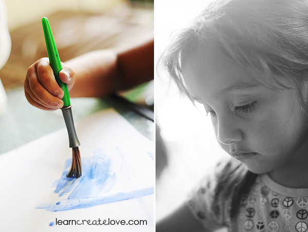 Lorelai painting the background with watercolors
