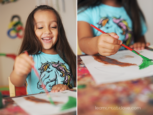 Painting her coconut tree while reciting parts of the book from memory. fun!